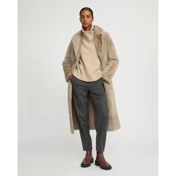 Woman wearing Yves Salomon shearling fur coat – luxury outerwear at Luxury Shoes 