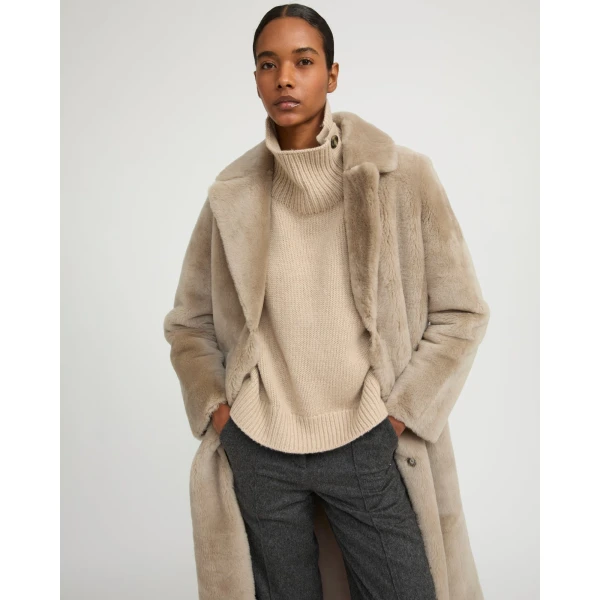Woman wearing Yves Salomon shearling fur coat – luxury outerwear at Luxury Shoes 