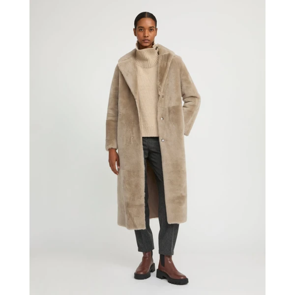 Woman wearing Yves Salomon shearling fur coat – luxury outerwear at Luxury Shoes 