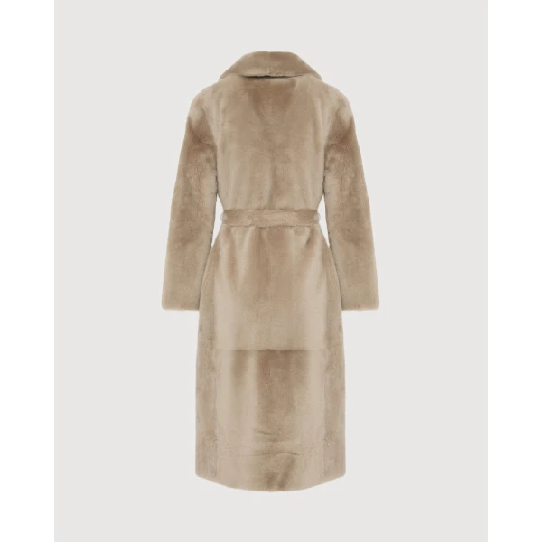 Woman wearing Yves Salomon shearling fur coat – luxury outerwear at Luxury Shoes 