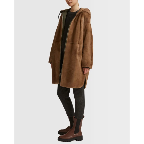 Woman wearing Yves Salomon shearling fur coat – luxury outerwear at Luxury Shoes 