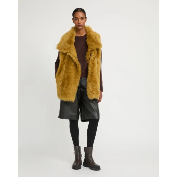Woman wearing Yves Salomon shearling fur coat – luxury outerwear at Luxury Shoes 