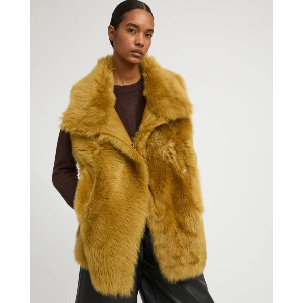 Woman wearing Yves Salomon shearling fur coat – luxury outerwear at Luxury Shoes 
