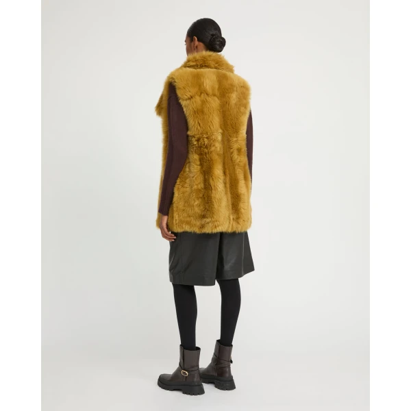 Woman wearing Yves Salomon shearling fur coat – luxury outerwear at Luxury Shoes 
