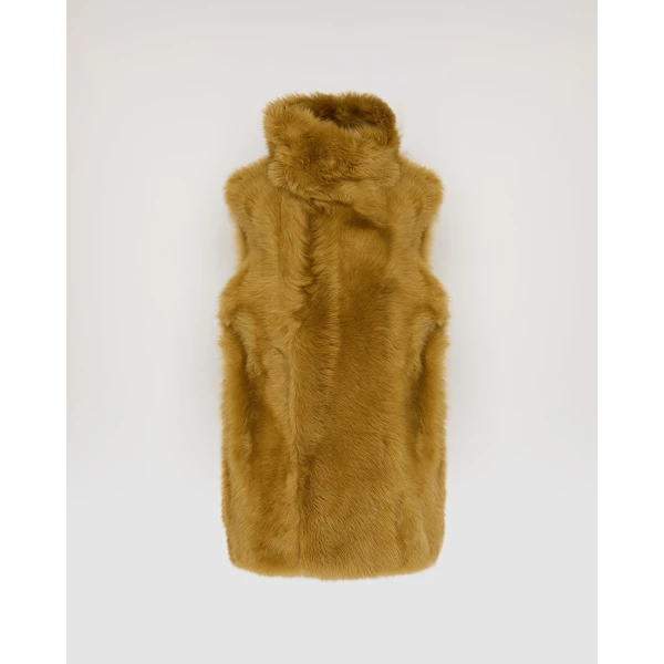 Woman wearing Yves Salomon shearling fur coat – luxury outerwear at Luxury Shoes 