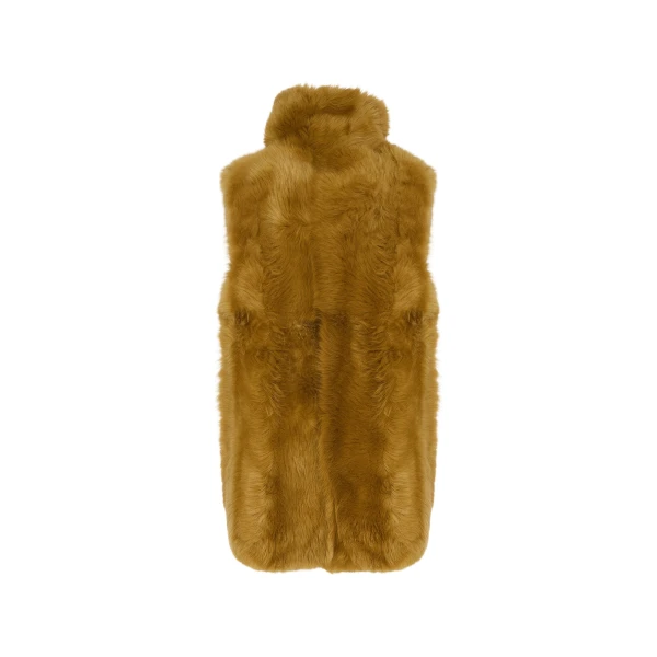 Woman wearing Yves Salomon shearling fur coat – luxury outerwear at Luxury Shoes 