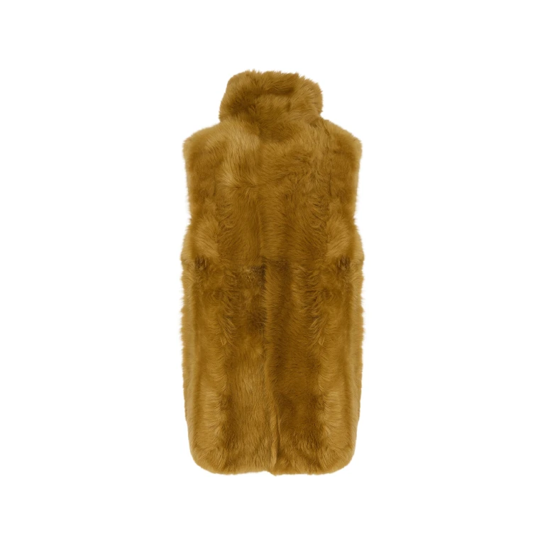 Woman wearing Yves Salomon shearling fur coat – luxury outerwear at Luxury Shoes 