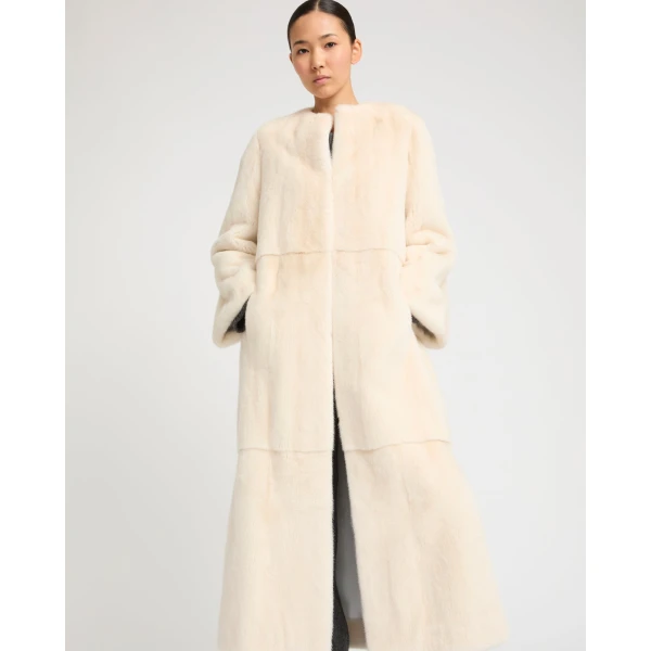 Woman wearing Yves Salomon shearling fur coat – luxury outerwear at Luxury Shoes 