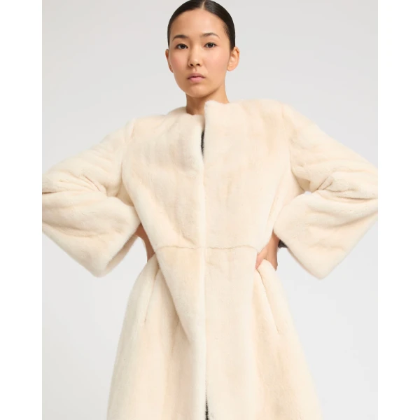 Woman wearing Yves Salomon shearling fur coat – luxury outerwear at Luxury Shoes 