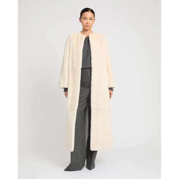 Woman wearing Yves Salomon shearling fur coat – luxury outerwear at Luxury Shoes 