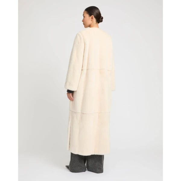 Woman wearing Yves Salomon shearling fur coat – luxury outerwear at Luxury Shoes 