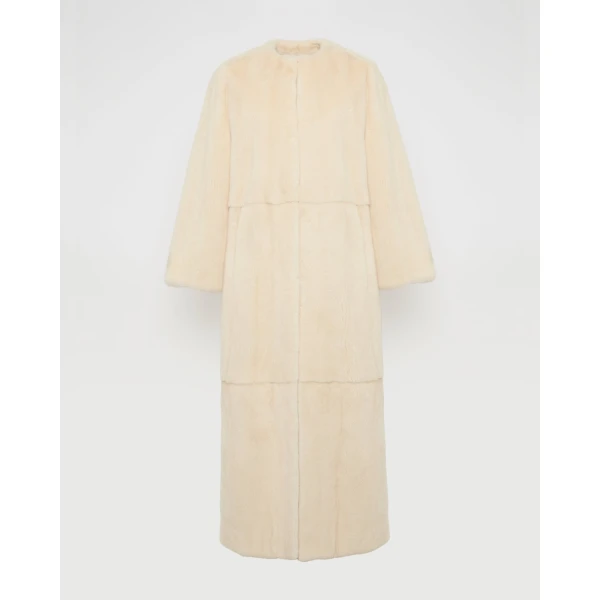 Woman wearing Yves Salomon shearling fur coat – luxury outerwear at Luxury Shoes 
