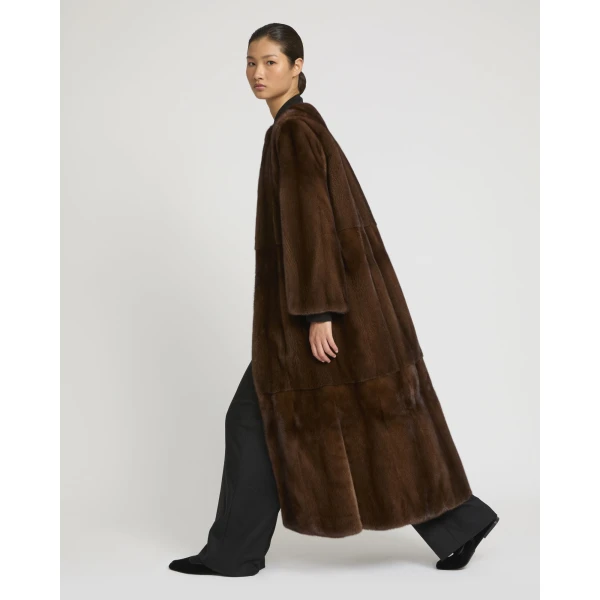 Woman wearing Yves Salomon shearling fur coat – luxury outerwear at Luxury Shoes 