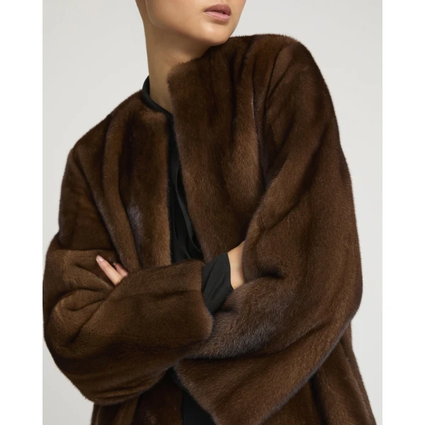 Woman wearing Yves Salomon shearling fur coat – luxury outerwear at Luxury Shoes 