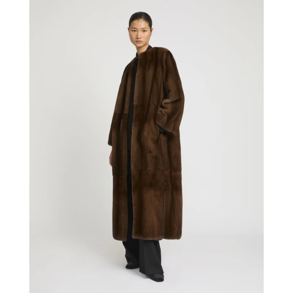 Woman wearing Yves Salomon shearling fur coat – luxury outerwear at Luxury Shoes 