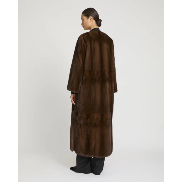 Woman wearing Yves Salomon shearling fur coat – luxury outerwear at Luxury Shoes 