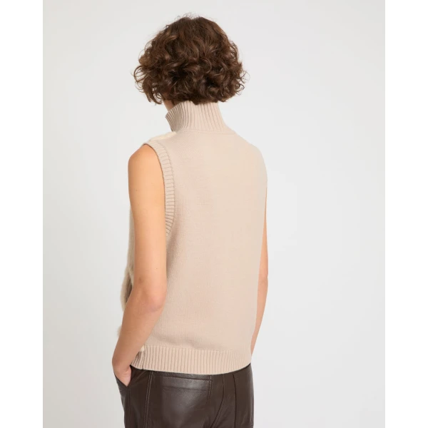 Woman wearing Yves Salomon shearling fur coat – luxury outerwear at Luxury Shoes 
