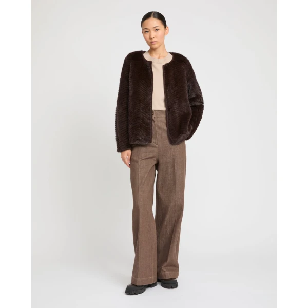 Woman wearing Yves Salomon shearling fur coat – luxury outerwear at Luxury Shoes 