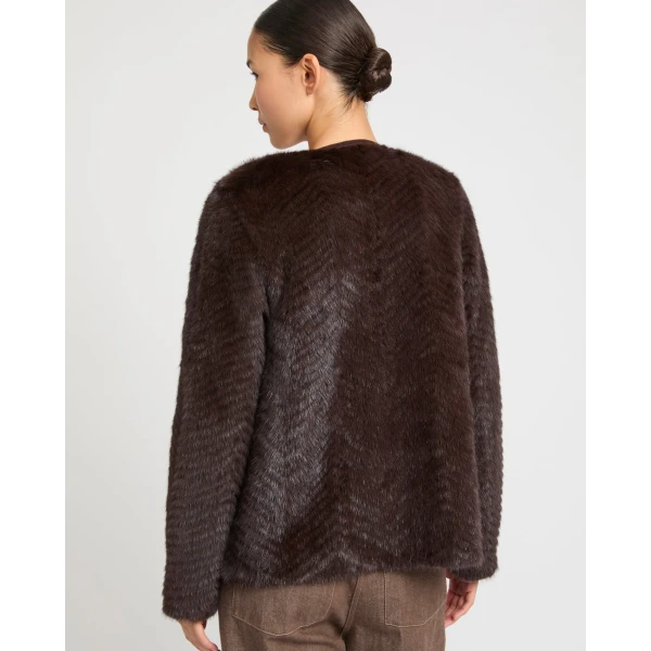 Woman wearing Yves Salomon shearling fur coat – luxury outerwear at Luxury Shoes 