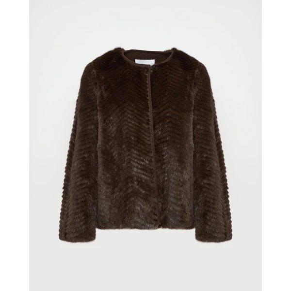 Woman wearing Yves Salomon shearling fur coat – luxury outerwear at Luxury Shoes 