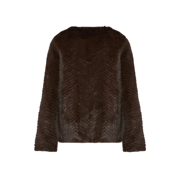 Woman wearing Yves Salomon shearling fur coat – luxury outerwear at Luxury Shoes 