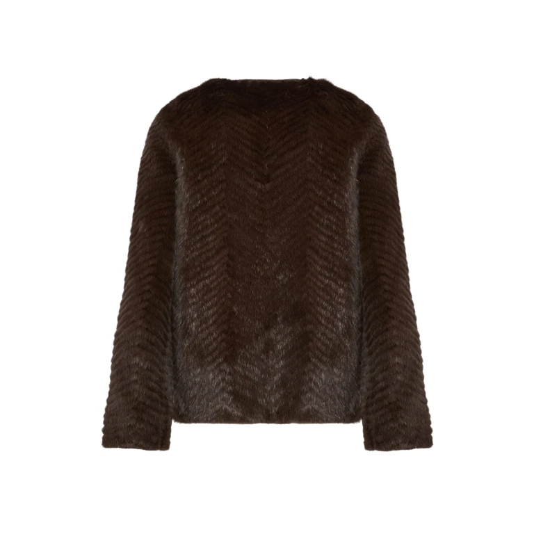 Woman wearing Yves Salomon shearling fur coat – luxury outerwear at Luxury Shoes 