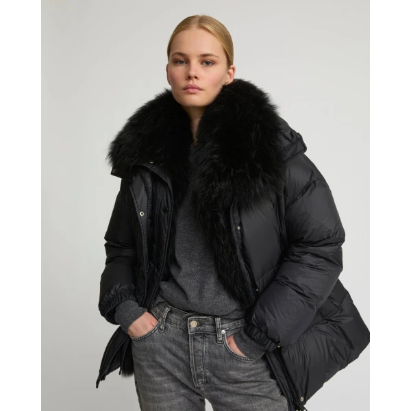 Woman wearing Yves Salomon shearling fur coat – luxury outerwear at Luxury Shoes 