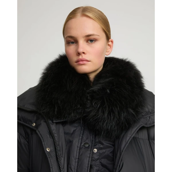 Woman wearing Yves Salomon shearling fur coat – luxury outerwear at Luxury Shoes 