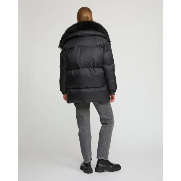 Woman wearing Yves Salomon shearling fur coat – luxury outerwear at Luxury Shoes 
