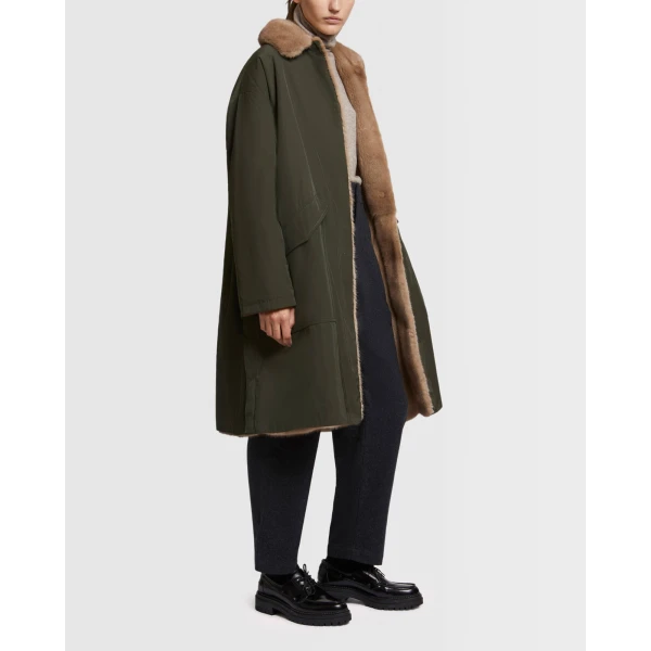 Woman wearing Yves Salomon shearling fur coat – luxury outerwear at Luxury Shoes 