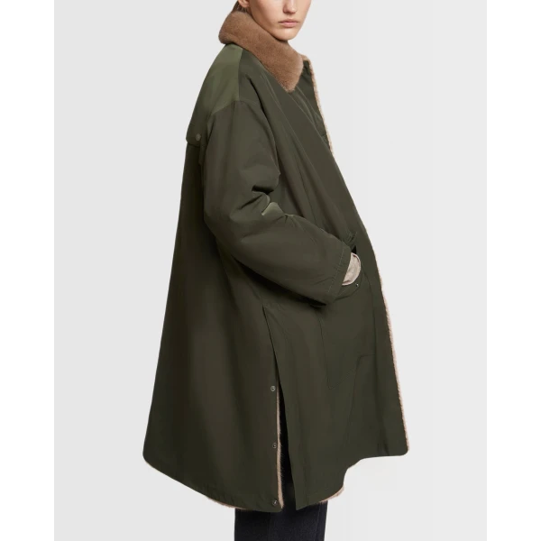 Woman wearing Yves Salomon shearling fur coat – luxury outerwear at Luxury Shoes 