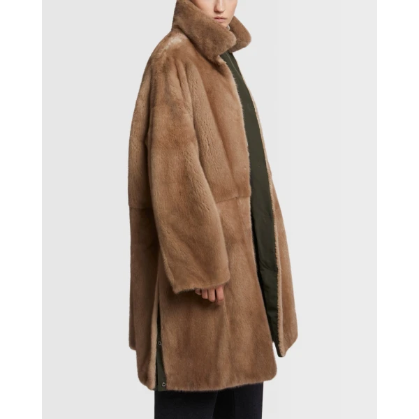 Woman wearing Yves Salomon shearling fur coat – luxury outerwear at Luxury Shoes 