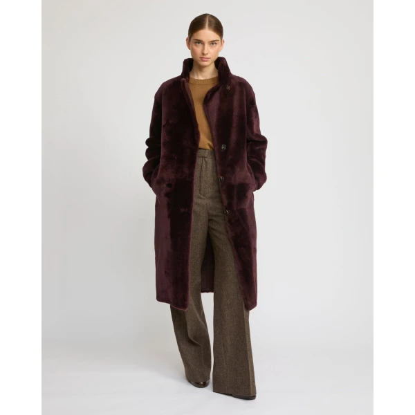 Woman wearing Yves Salomon shearling fur coat – luxury outerwear at Luxury Shoes 
