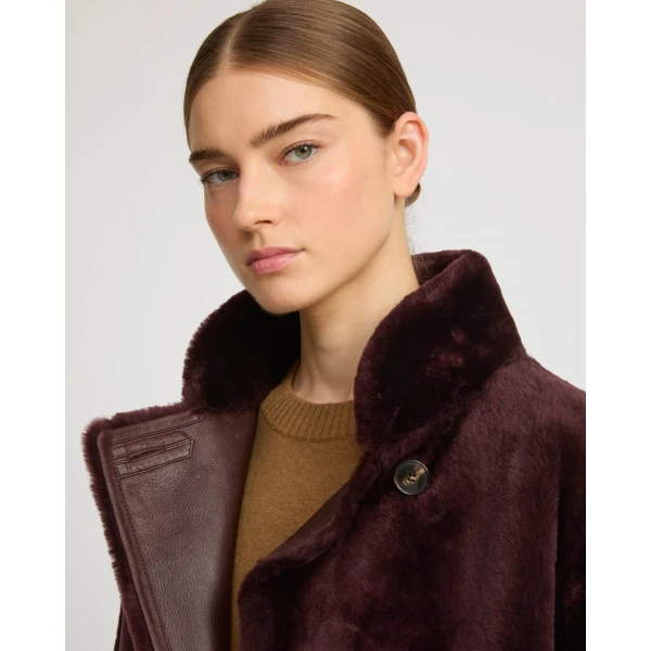 Woman wearing Yves Salomon shearling fur coat – luxury outerwear at Luxury Shoes 