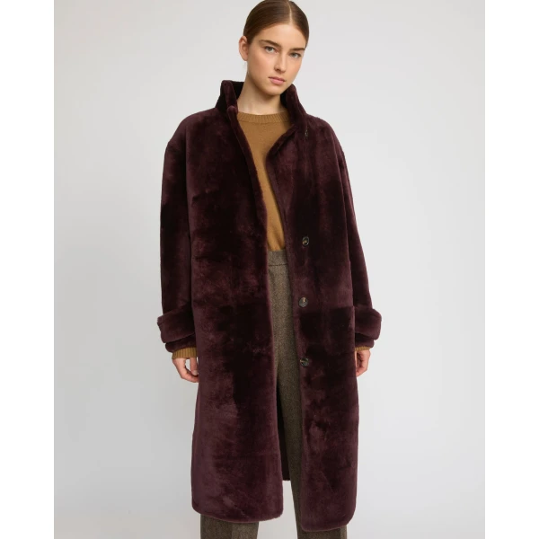 Woman wearing Yves Salomon shearling fur coat – luxury outerwear at Luxury Shoes 
