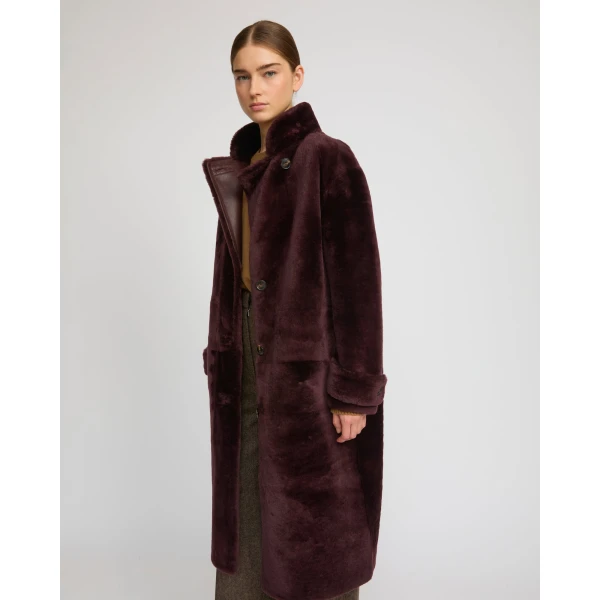 Woman wearing Yves Salomon shearling fur coat – luxury outerwear at Luxury Shoes 