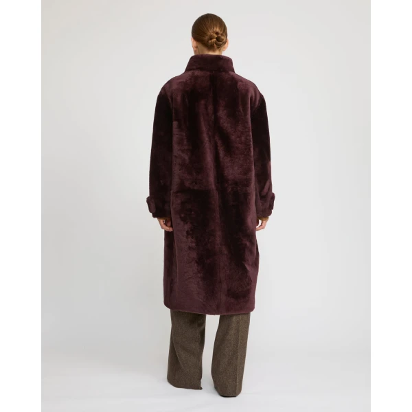 Woman wearing Yves Salomon shearling fur coat – luxury outerwear at Luxury Shoes 