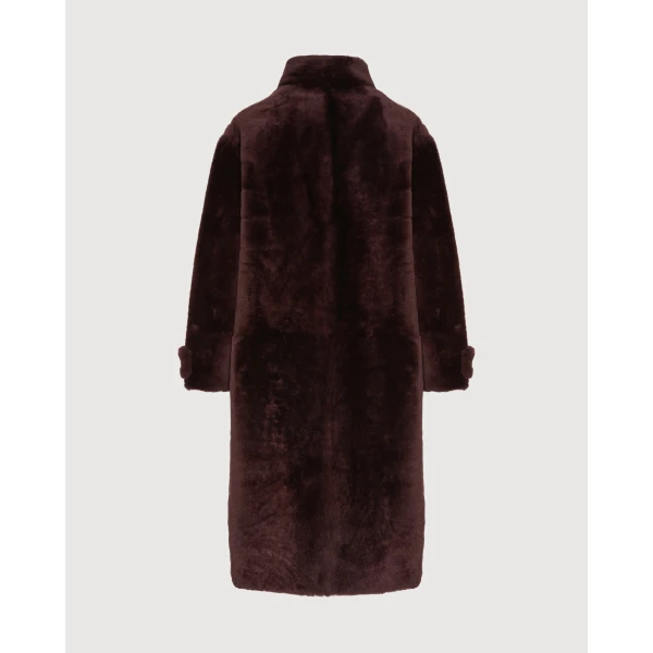 Woman wearing Yves Salomon shearling fur coat – luxury outerwear at Luxury Shoes 