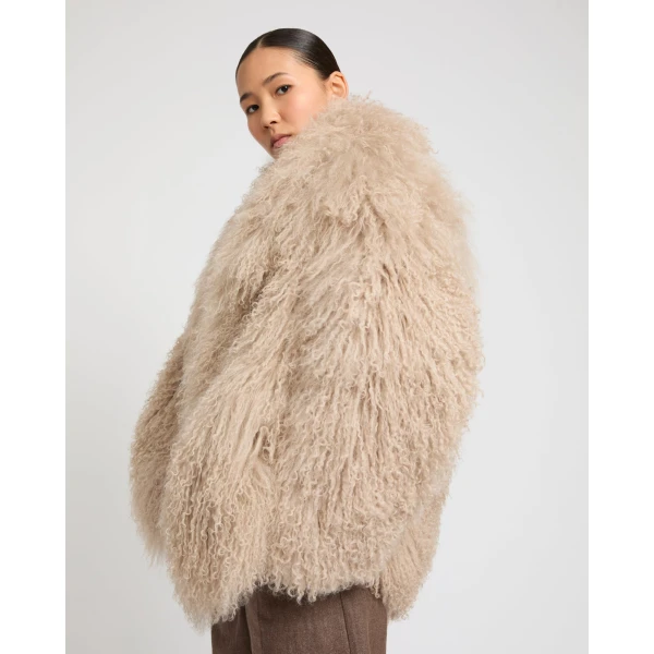 Woman wearing Yves Salomon shearling fur coat – luxury outerwear at Luxury Shoes 