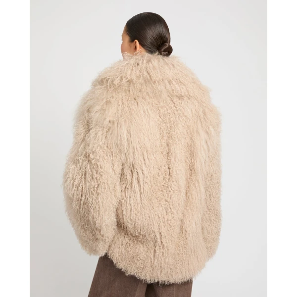 Woman wearing Yves Salomon shearling fur coat – luxury outerwear at Luxury Shoes 