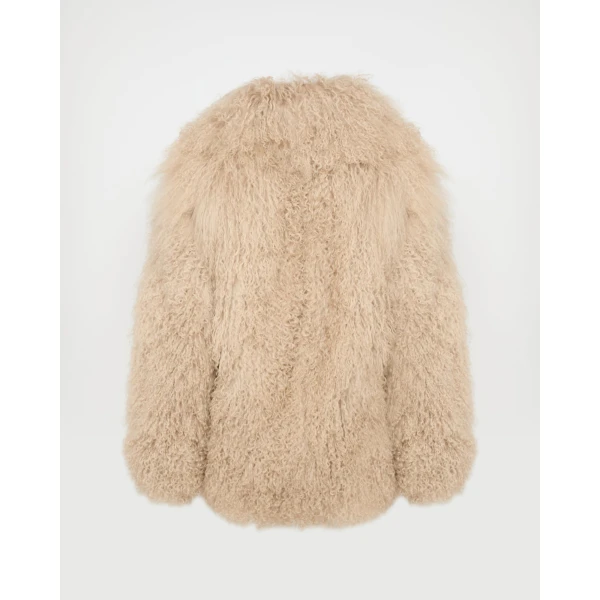 Woman wearing Yves Salomon shearling fur coat – luxury outerwear at Luxury Shoes 