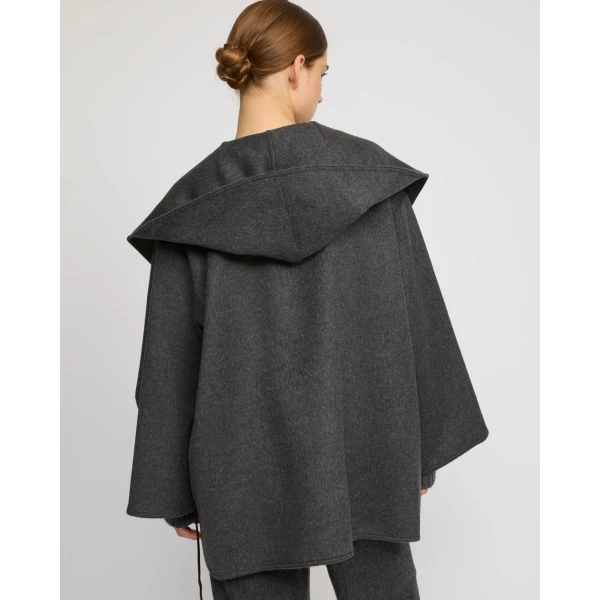 Woman wearing Yves Salomon shearling fur coat – luxury outerwear at Luxury Shoes 