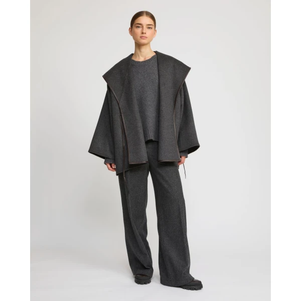 Woman wearing Yves Salomon shearling fur coat – luxury outerwear at Luxury Shoes 