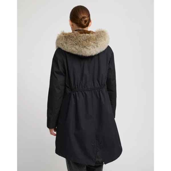 Woman wearing Yves Salomon shearling fur coat – luxury outerwear at Luxury Shoes 