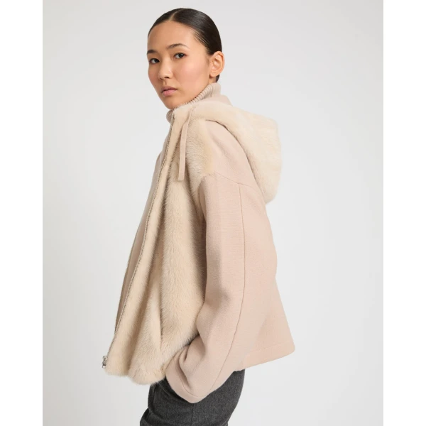 Woman wearing Yves Salomon shearling fur coat – luxury outerwear at Luxury Shoes 