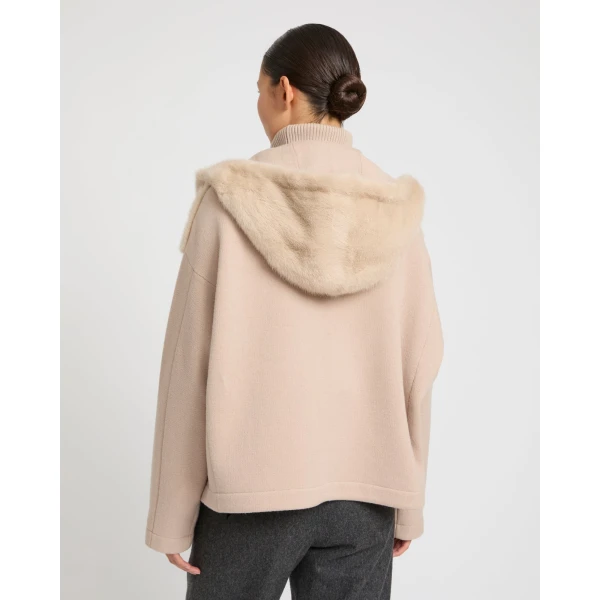 Woman wearing Yves Salomon shearling fur coat – luxury outerwear at Luxury Shoes 