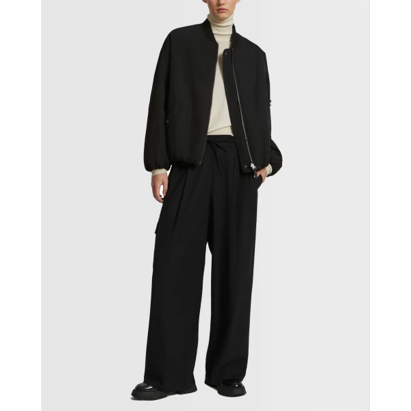 Woman wearing Yves Salomon shearling fur coat – luxury outerwear at Luxury Shoes 