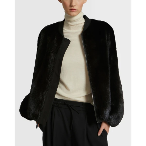 Woman wearing Yves Salomon shearling fur coat – luxury outerwear at Luxury Shoes 
