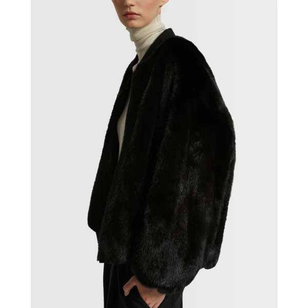 Woman wearing Yves Salomon shearling fur coat – luxury outerwear at Luxury Shoes 