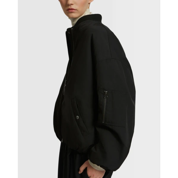 Woman wearing Yves Salomon shearling fur coat – luxury outerwear at Luxury Shoes 